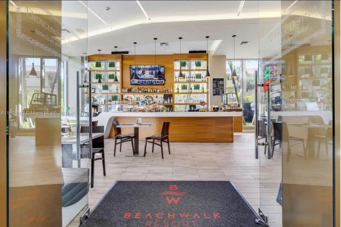 2602 East Hallandale Beach Boulevard, Unit R807 Hallandale Beach, FL 33009 - Photo 9 of 37 a view of a dining room with furniture