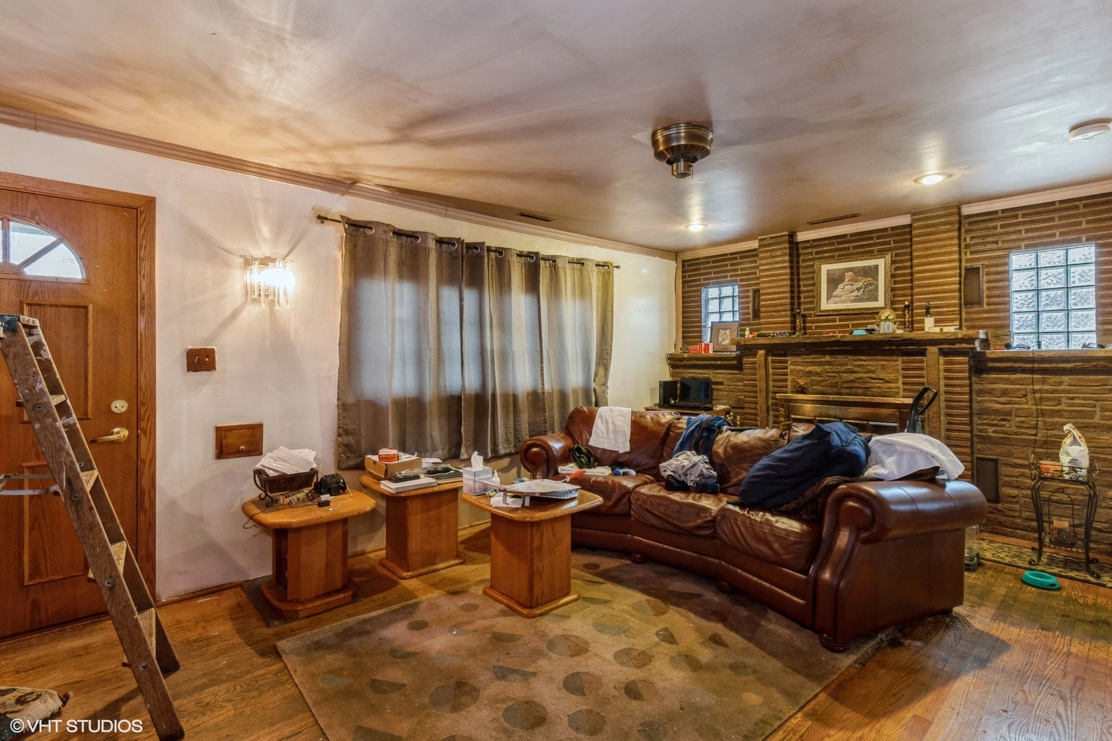 4341 Ruby Street Schiller Park, IL 60176 - Photo 3 of 10 a living room with fireplace furniture and a fireplace
