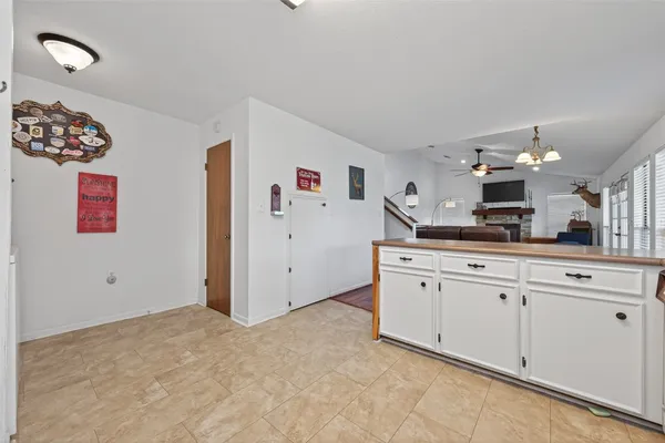 a view of a kitchen with cabinets