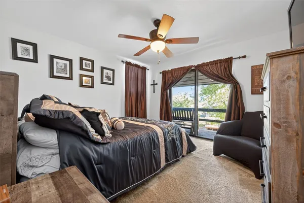 a bedroom with a bed couch and window