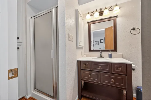 a view of a bathroom with a sink mirror and