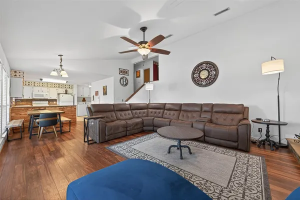 a living room with furniture and a table