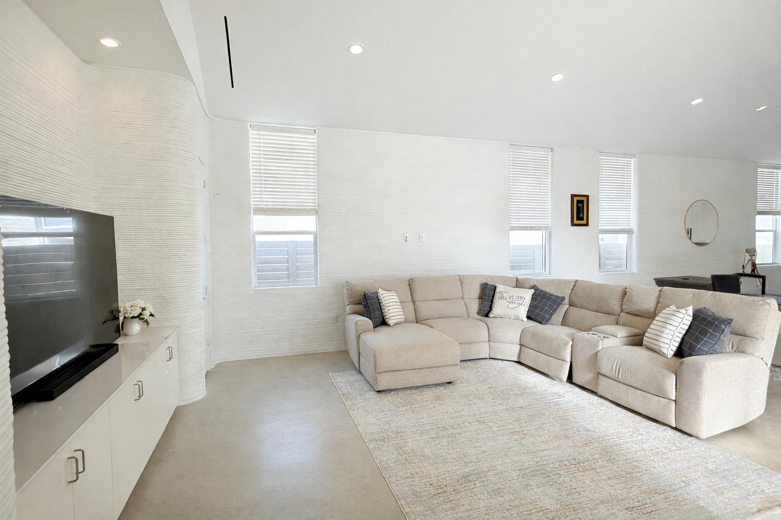 332 Blue Blaze Trail Georgetown, TX 78628 - Photo 5 of 16 Living area featuring plenty of natural light, recessed lighting, concrete floors, and tile walls