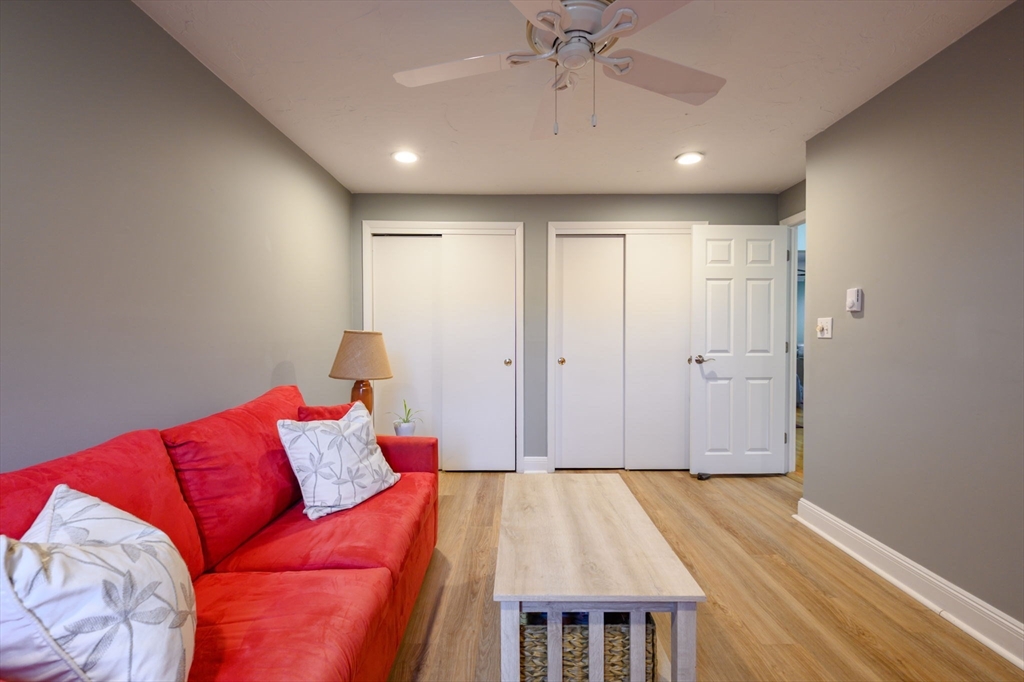 53 Will Drive, Unit 143 Canton, MA 02021 - Photo 15 of 23 a bed room with a bed and a couch