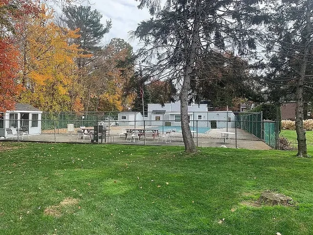 a house view with a sitting space and garden