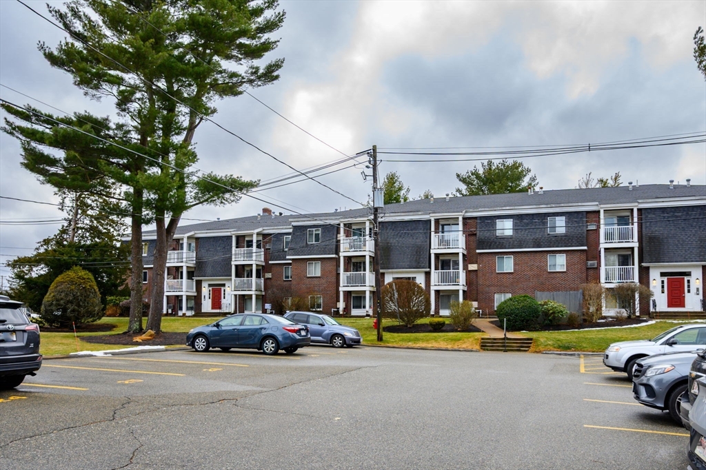 53 Will Drive, Unit 143 Canton, MA 02021 - Photo 22 of 23 a car parked in front of a house