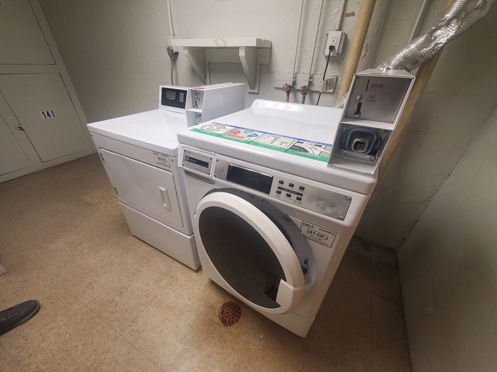 53 Will Drive, Unit 143 Canton, MA 02021 - Photo 23 of 23 a utility room with dryer and washer