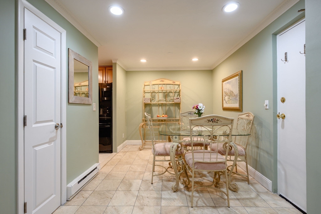 53 Will Drive, Unit 143 Canton, MA 02021 - Photo 5 of 23 a view of a dining room with furniture