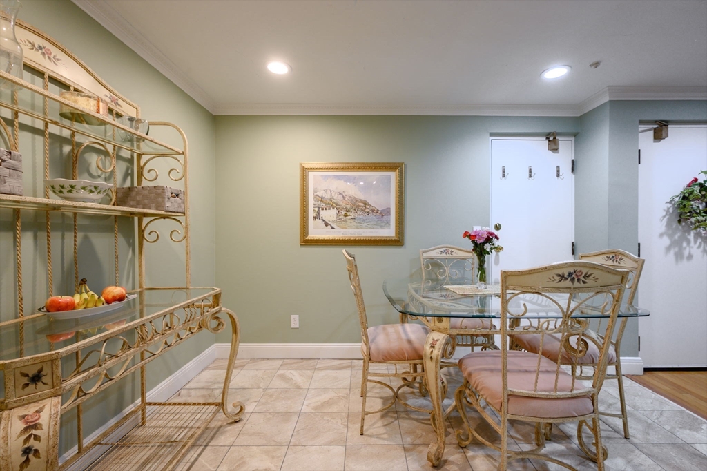 53 Will Drive, Unit 143 Canton, MA 02021 - Photo 6 of 23 a dining room with furniture and wooden floor