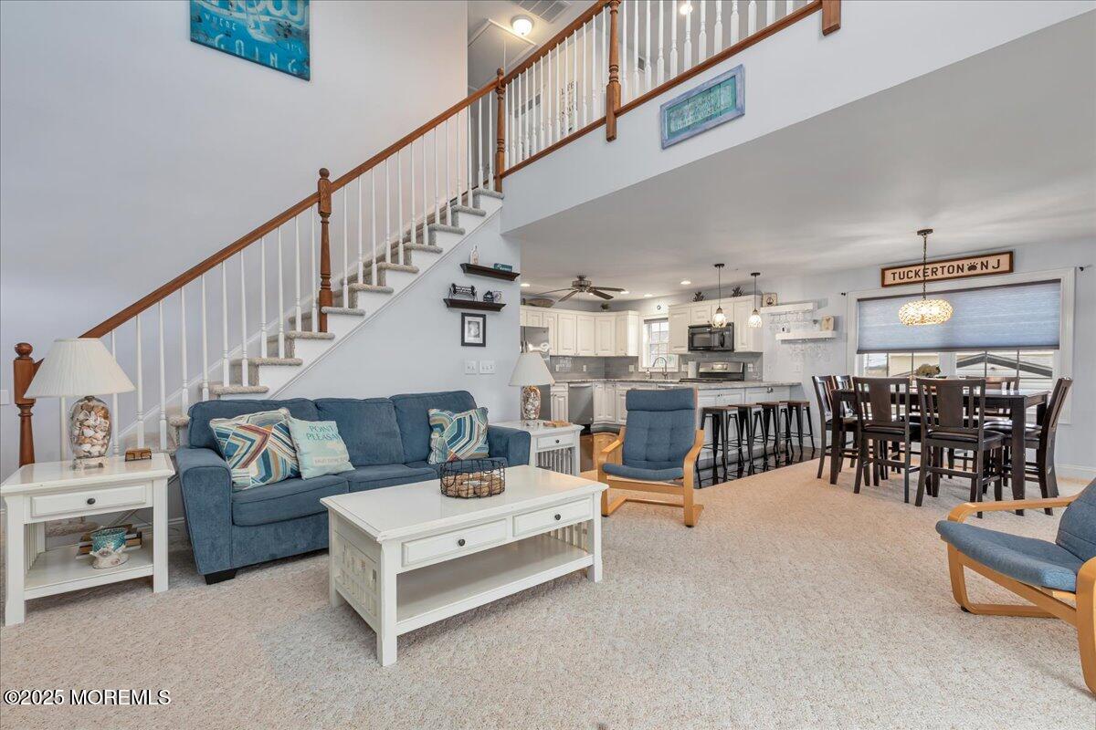 186 Flamingo Road Tuckerton, NJ 08087 - Photo 11 of 55 a living room with furniture and a dining table