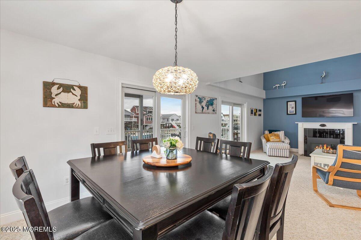 186 Flamingo Road Tuckerton, NJ 08087 - Photo 15 of 55 a view of a dining room with furniture and chandelier