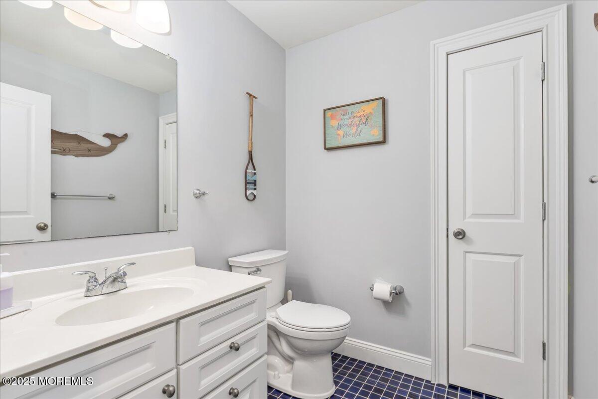 186 Flamingo Road Tuckerton, NJ 08087 - Photo 20 of 55 a bathroom with a sink a toilet and shower