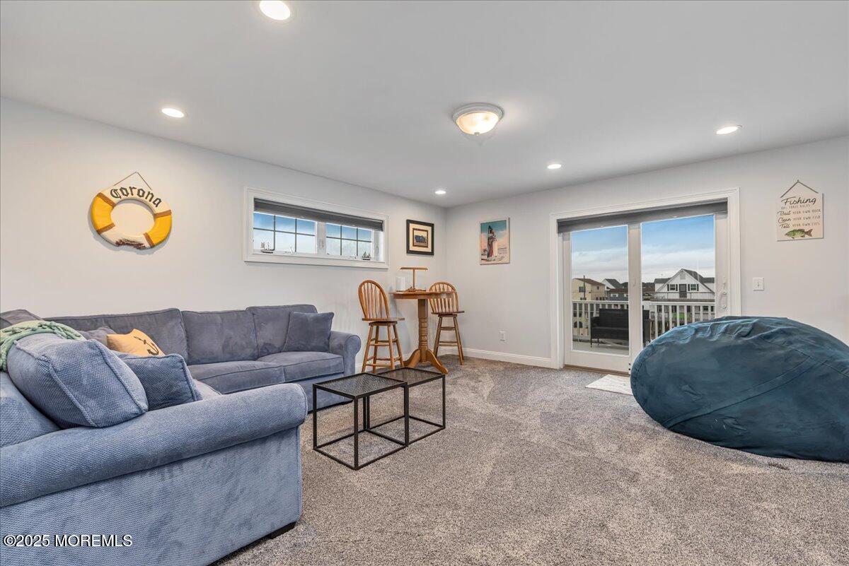 186 Flamingo Road Tuckerton, NJ 08087 - Photo 27 of 55 a living room with furniture and a flat screen tv