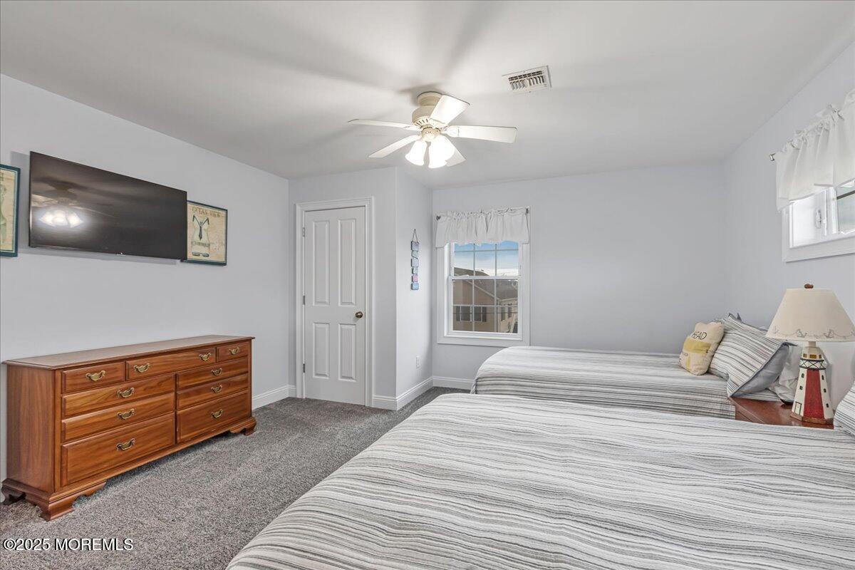 186 Flamingo Road Tuckerton, NJ 08087 - Photo 35 of 55 a bedroom with a bed and a flat screen tv