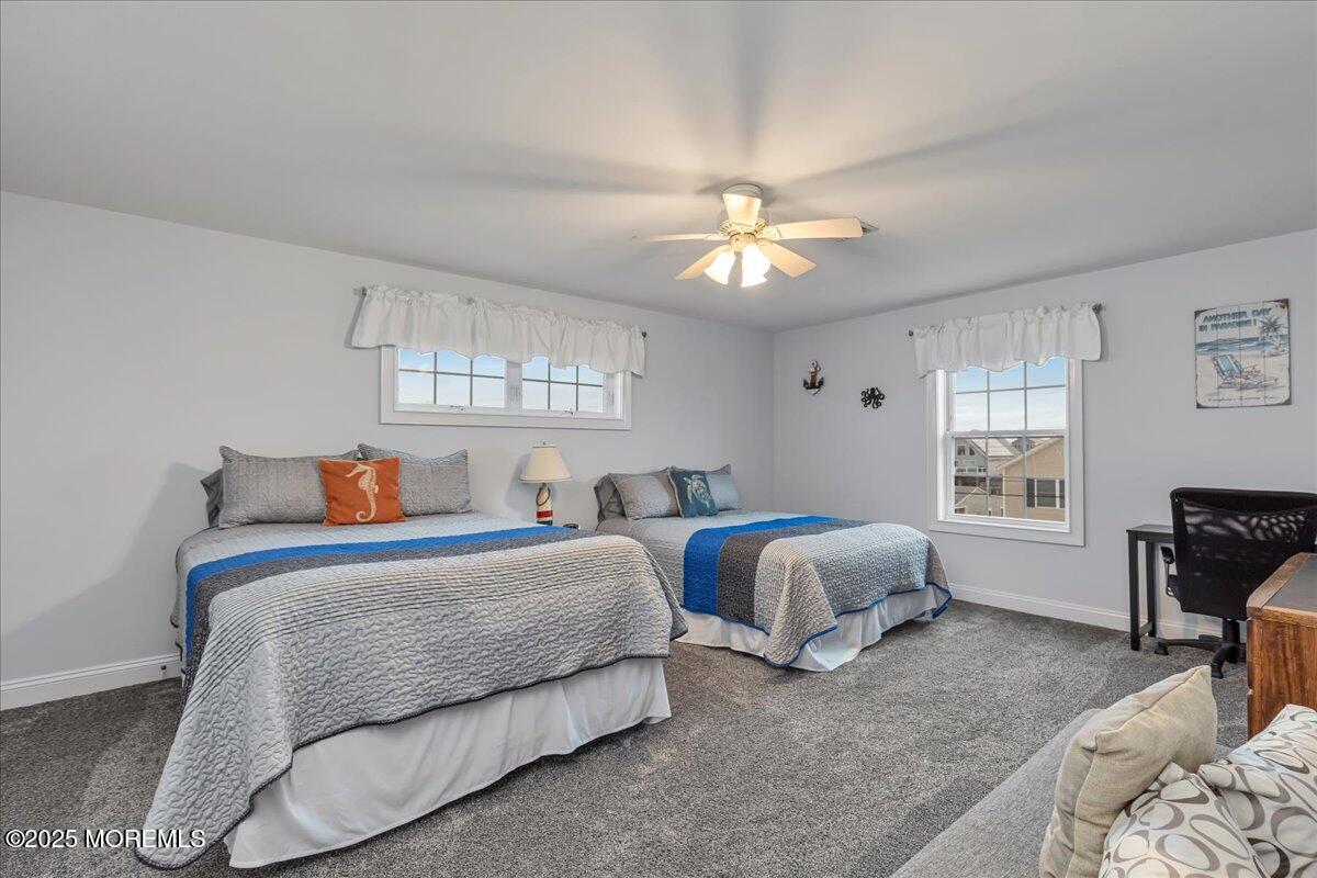 186 Flamingo Road Tuckerton, NJ 08087 - Photo 36 of 55 a bedroom with two beds and a couch