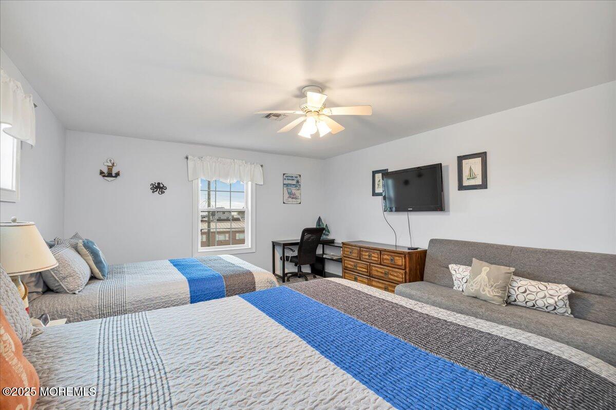 186 Flamingo Road Tuckerton, NJ 08087 - Photo 37 of 55 a bedroom with a bed and wooden floor