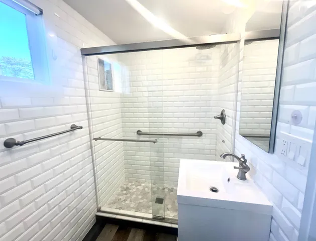 a bathroom with a sink and a shower