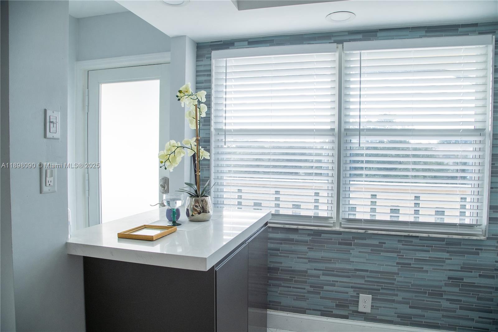 2304 Lucaya Lane, Unit J4 Coconut Creek, FL 33066 - Photo 12 of 50 a bathroom with a sink and a window