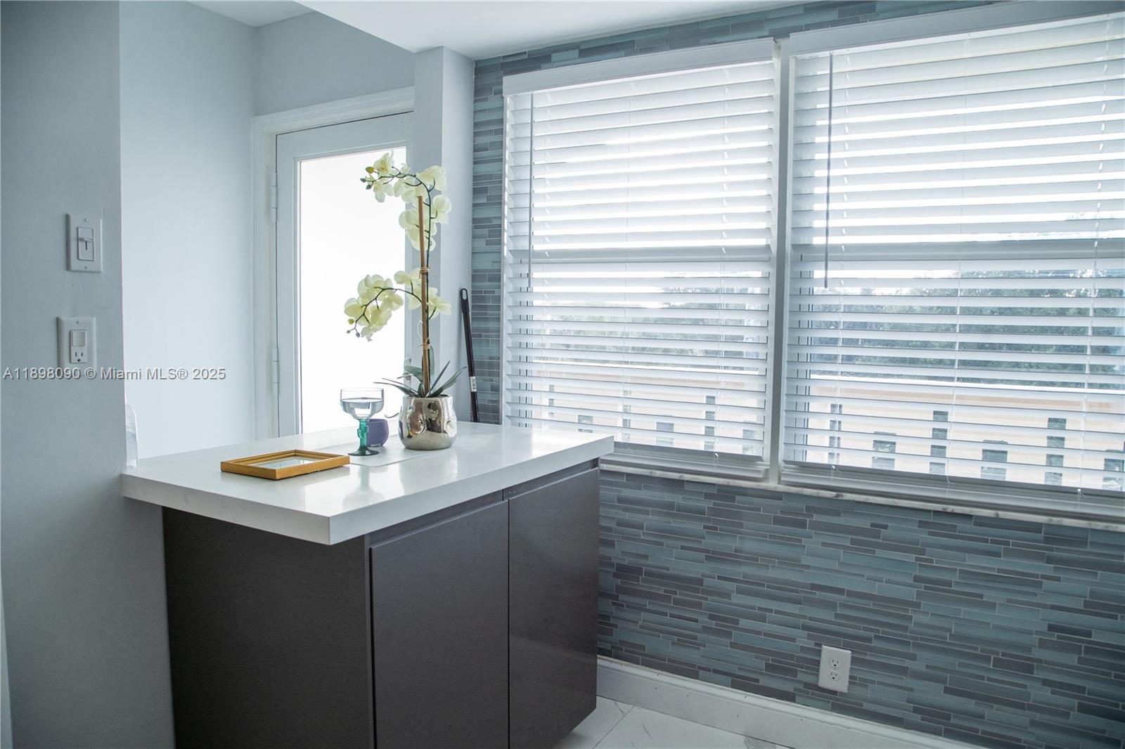 2304 Lucaya Lane, Unit J4 Coconut Creek, FL 33066 - Photo 13 of 50 a bathroom with a sink and a window