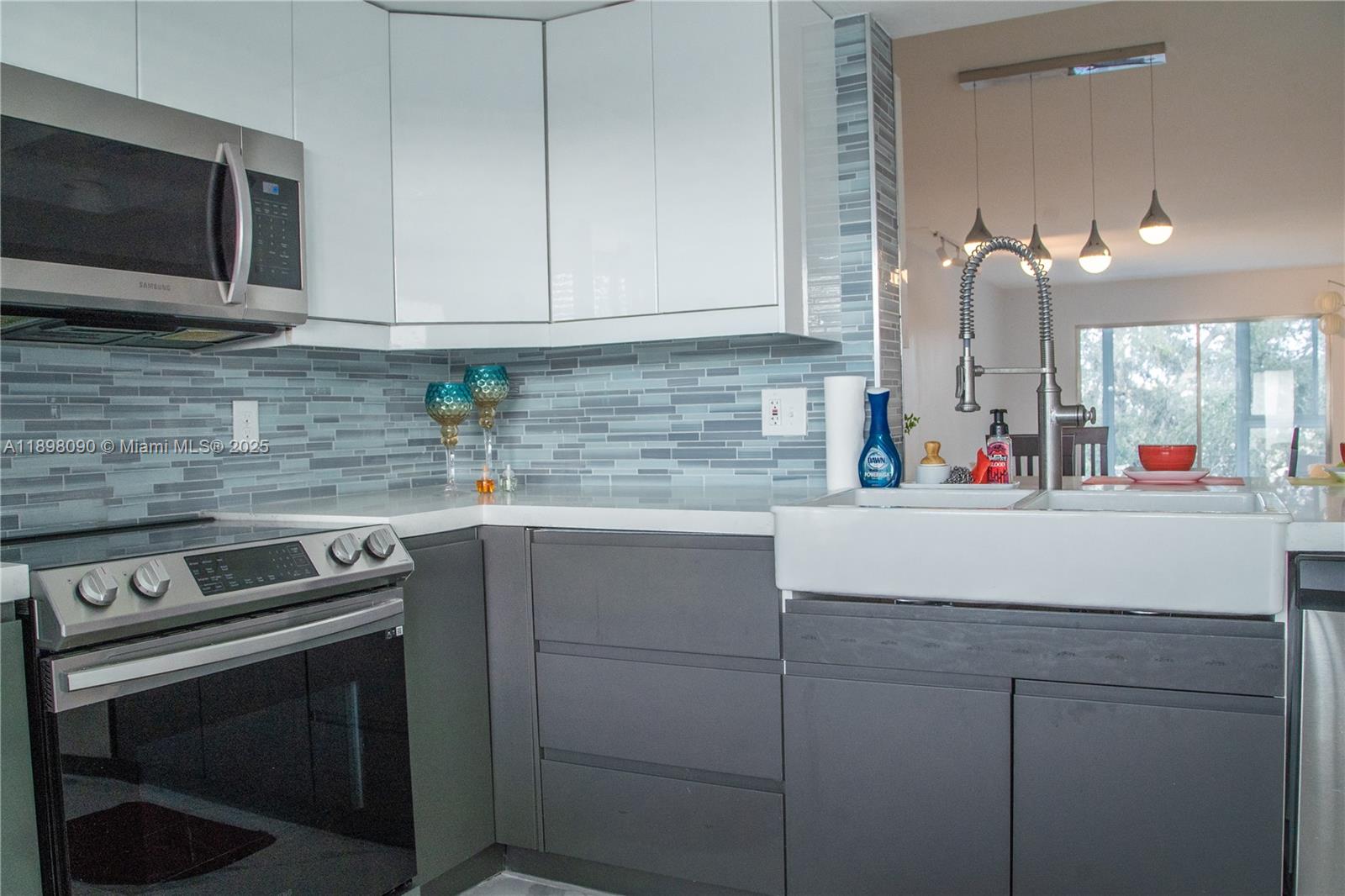 2304 Lucaya Lane, Unit J4 Coconut Creek, FL 33066 - Photo 15 of 50 a kitchen with cabinets appliances and a sink