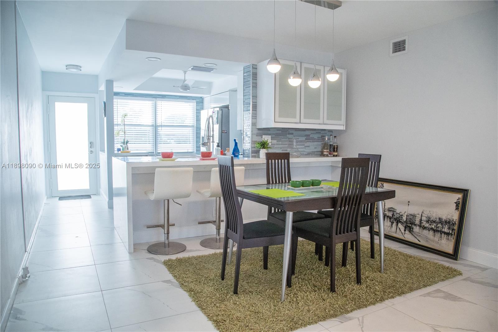 2304 Lucaya Lane, Unit J4 Coconut Creek, FL 33066 - Photo 17 of 50 a view of a dining room with furniture