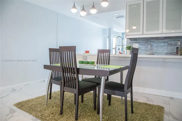 a view of a dining room with furniture