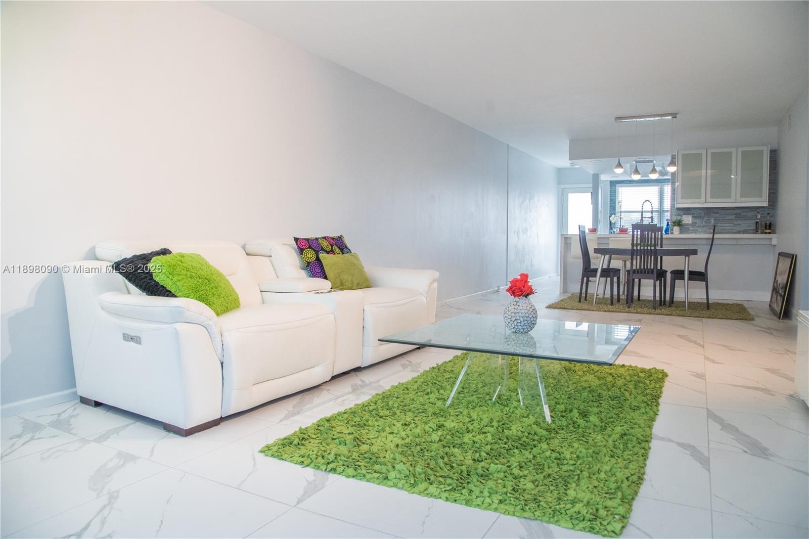 2304 Lucaya Lane, Unit J4 Coconut Creek, FL 33066 - Photo 25 of 50 a living room with furniture and a table