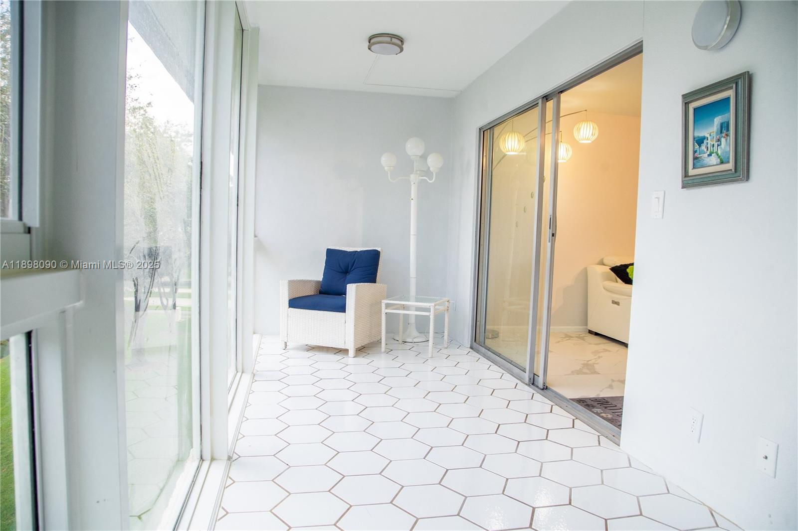 2304 Lucaya Lane, Unit J4 Coconut Creek, FL 33066 - Photo 28 of 50 a view of a room with a flat screen tv and front door