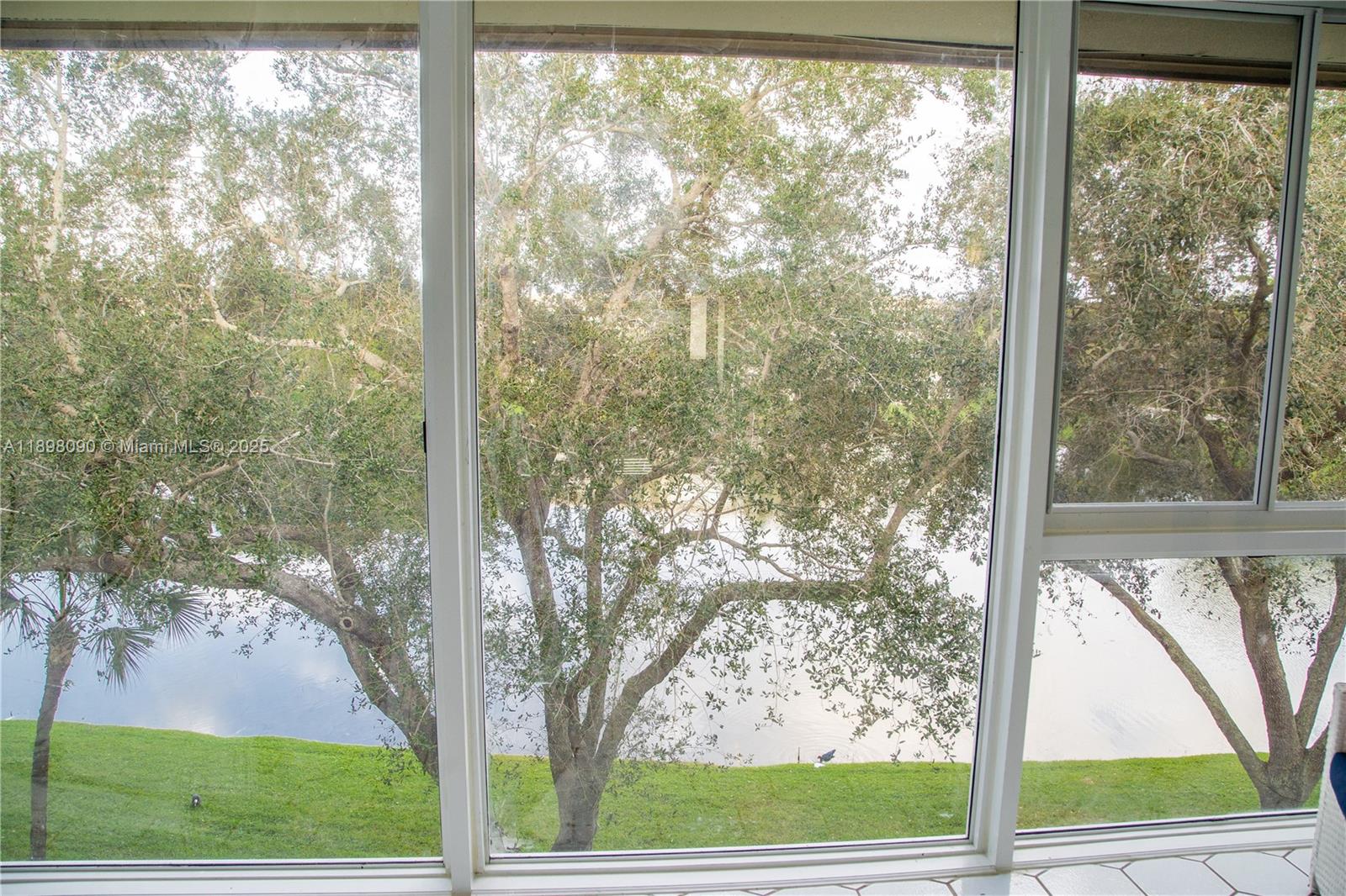 2304 Lucaya Lane, Unit J4 Coconut Creek, FL 33066 - Photo 31 of 50 a view of a garden from a window