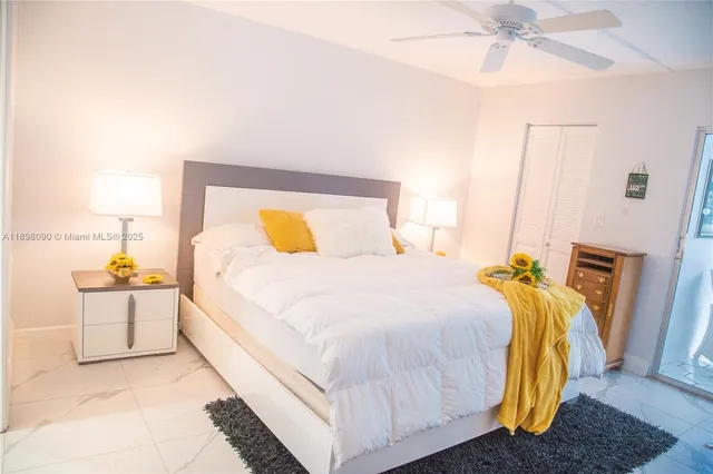 a bedroom with a bed and lamp