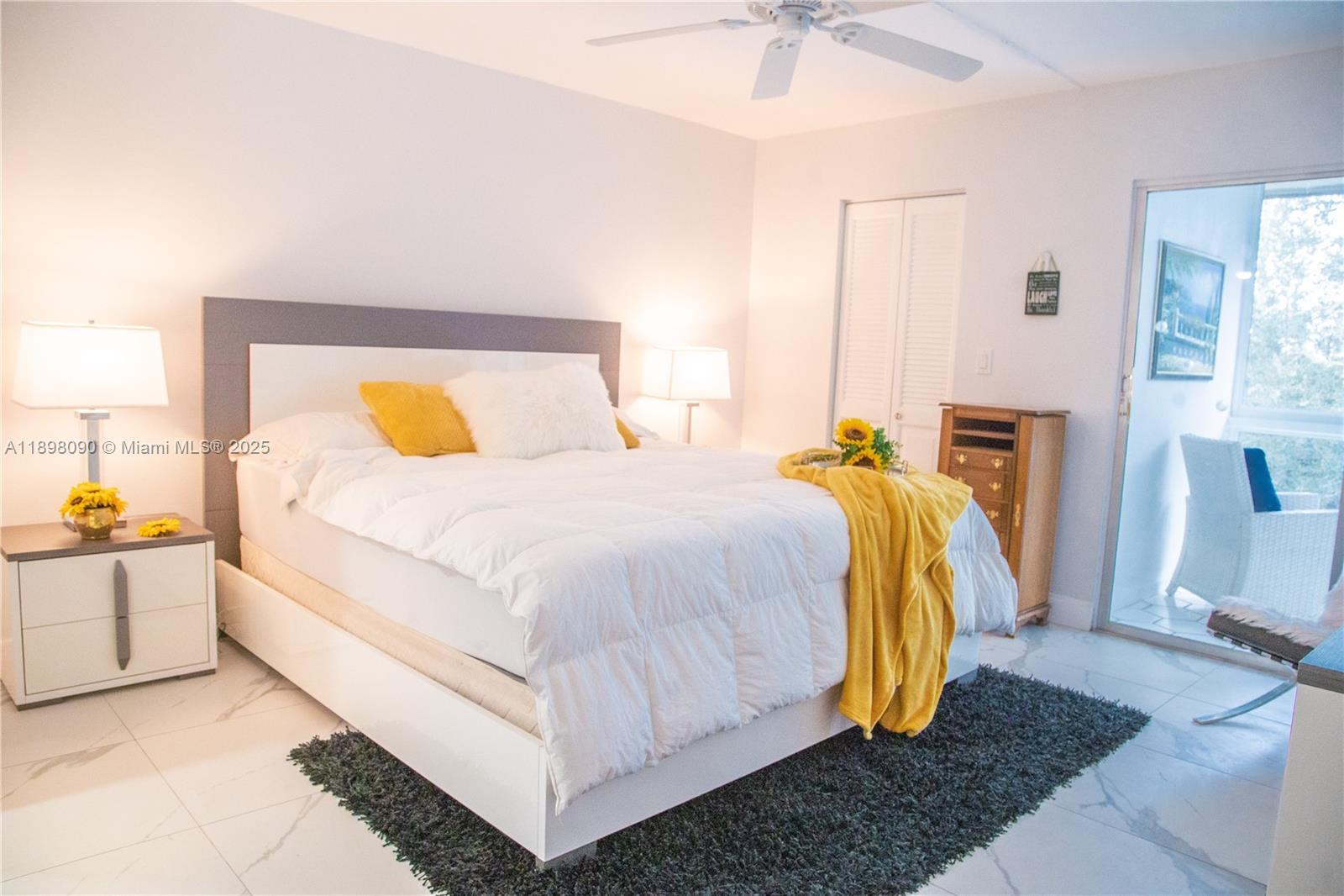 2304 Lucaya Lane, Unit J4 Coconut Creek, FL 33066 - Photo 35 of 50 a bed room with a bed and a couch