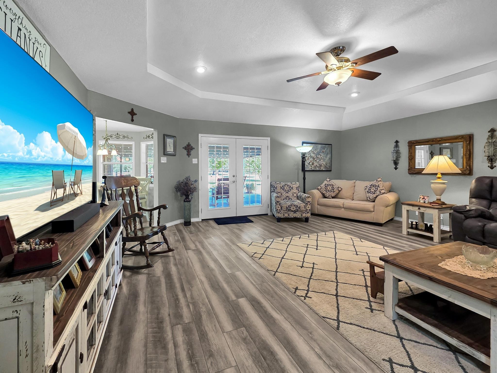 738 Parish Road Orange, TX 77632 - Photo 17 of 45 a living room with furniture and a flat screen tv