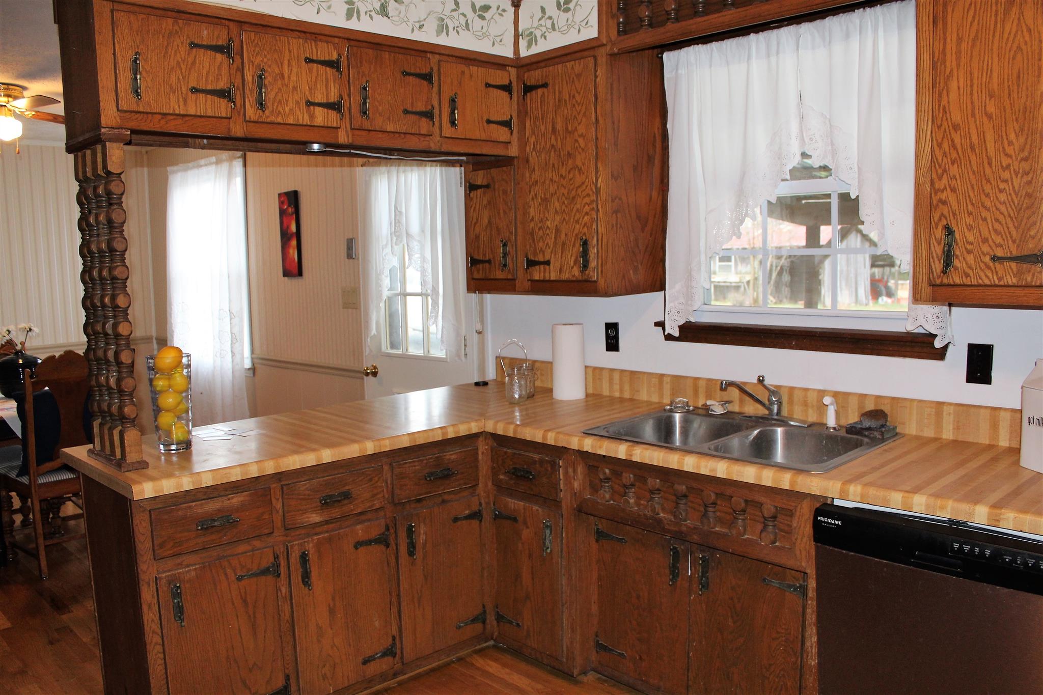 640 Pruett Road Dickson, TN 37055 - Photo 11 of 28 a kitchen with stainless steel appliances granite countertop a sink a stove and cabinets