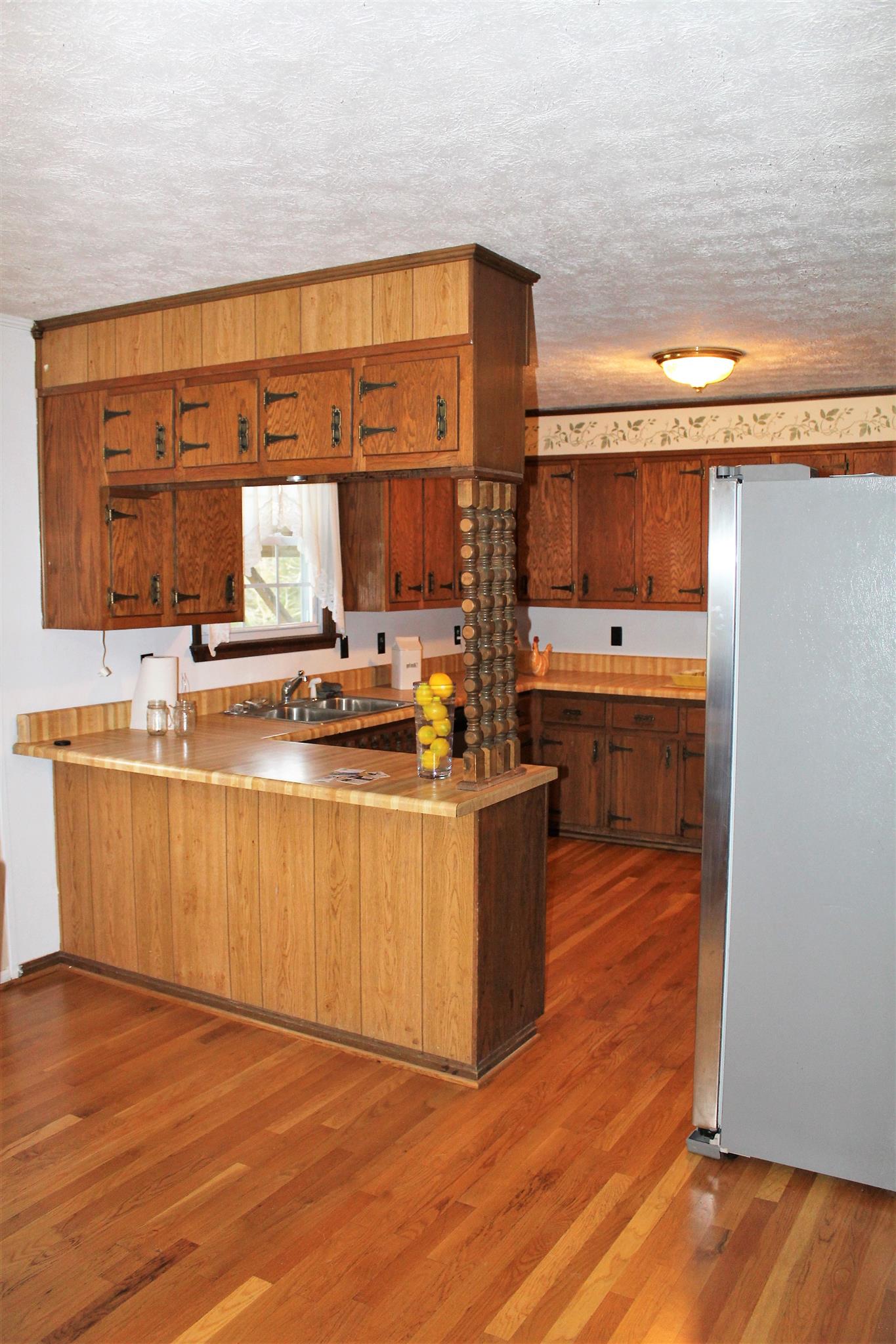 640 Pruett Road Dickson, TN 37055 - Photo 12 of 28 a kitchen with stainless steel appliances granite countertop a sink and a stove