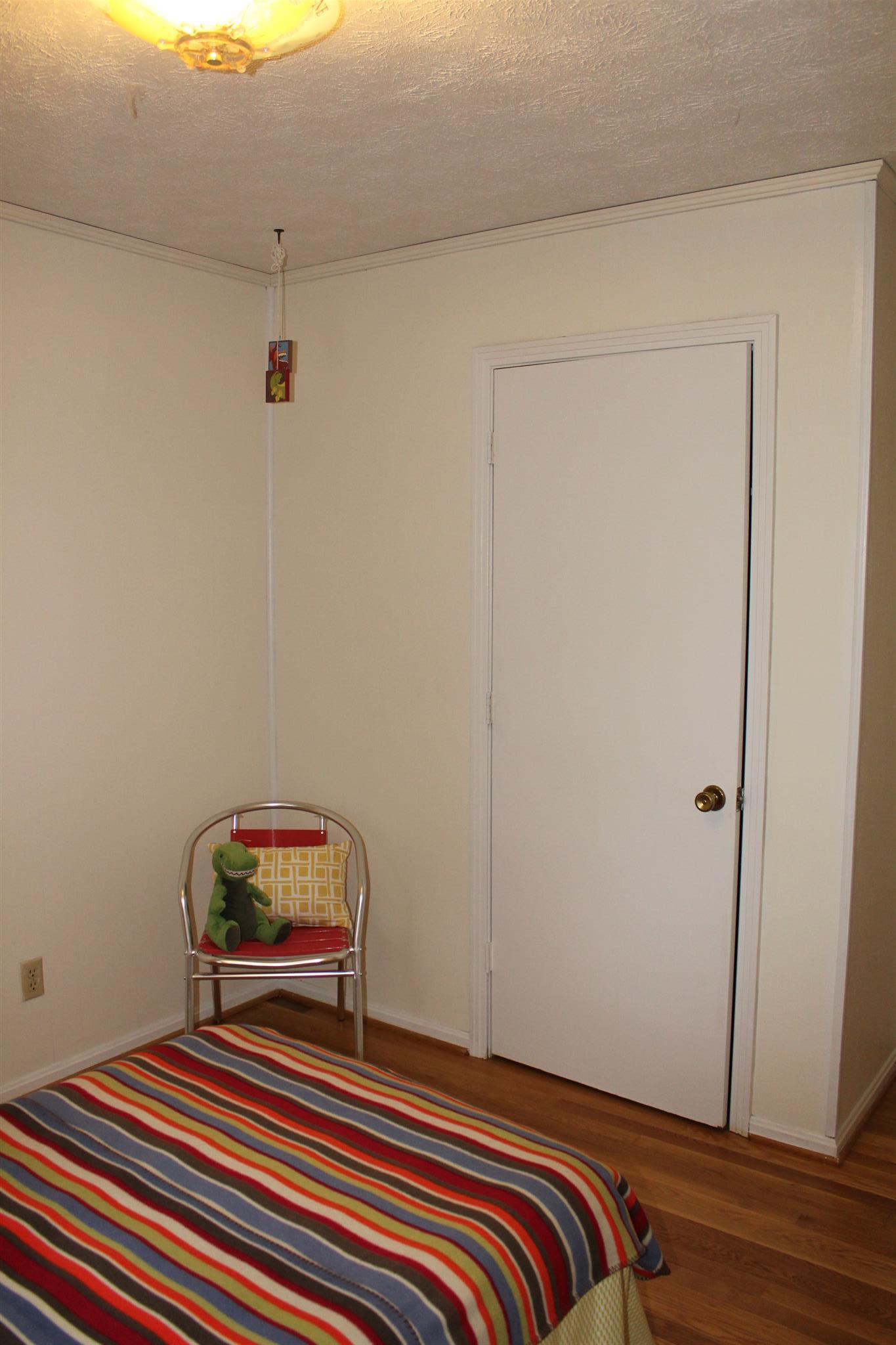 640 Pruett Road Dickson, TN 37055 - Photo 19 of 28 a bedroom with a bed and a mirror