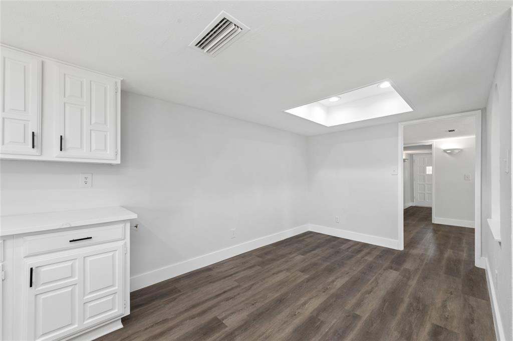 2119 Meadfoot Road Carrollton, TX 75007 - Photo 13 of 34 Unfurnished dining area with dark wood-type flooring and recessed lighting