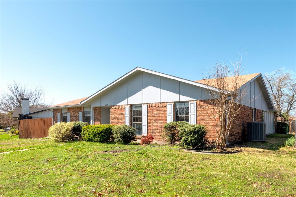 2119 Meadfoot Road Carrollton, TX 75007 - Photo 2 of 34 View of front of home with board and batten siding and brick siding