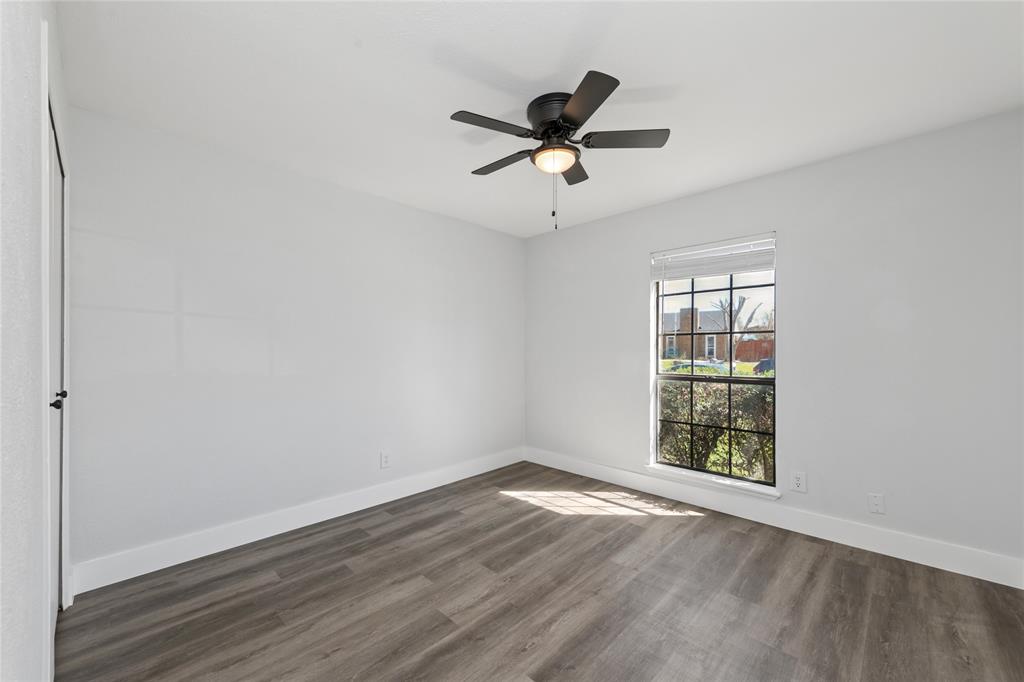 2119 Meadfoot Road Carrollton, TX 75007 - Photo 21 of 34 Spare room featuring dark wood finished floors and ceiling fan