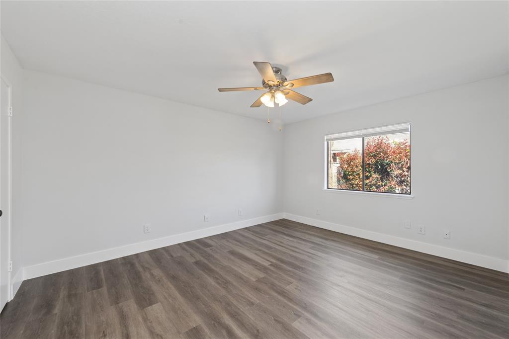 2119 Meadfoot Road Carrollton, TX 75007 - Photo 26 of 34 Unfurnished room featuring dark wood-type flooring and a ceiling fan