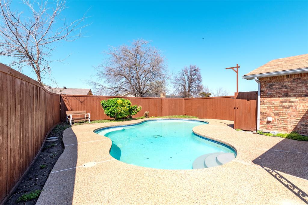 2119 Meadfoot Road Carrollton, TX 75007 - Photo 30 of 34 View of pool with a fenced backyard and patio surround