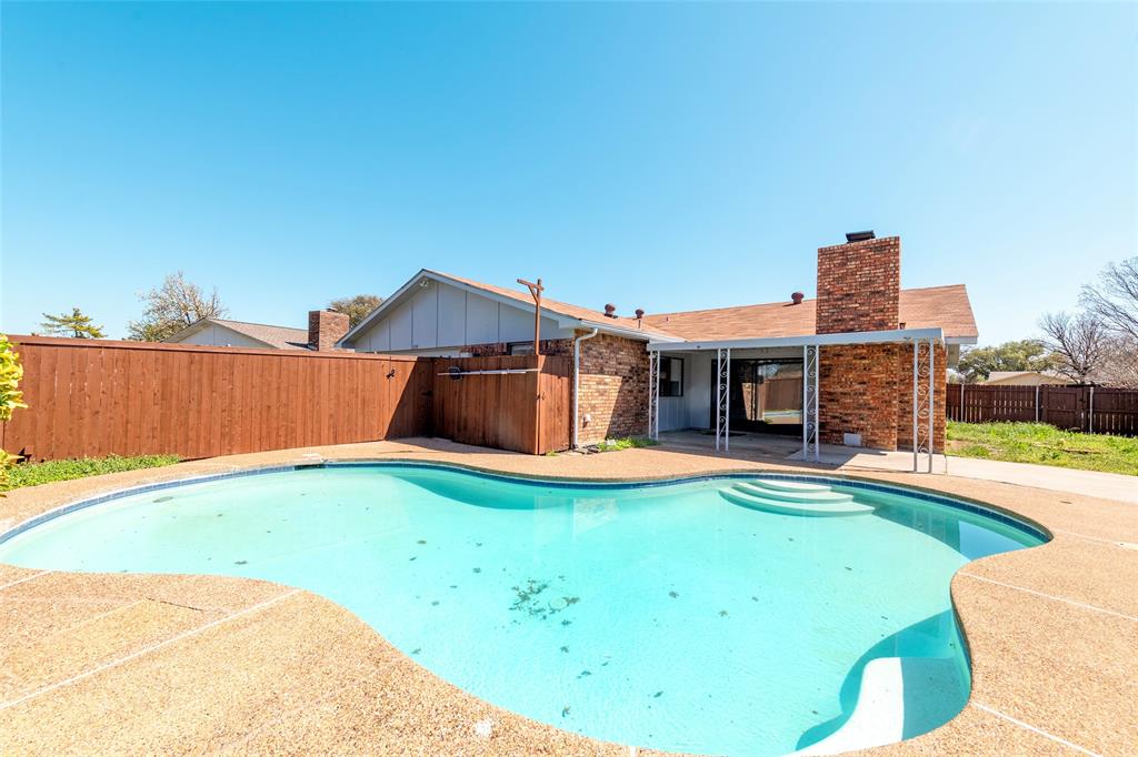 2119 Meadfoot Road Carrollton, TX 75007 - Photo 31 of 34 View of pool featuring patio surround and a fenced backyard