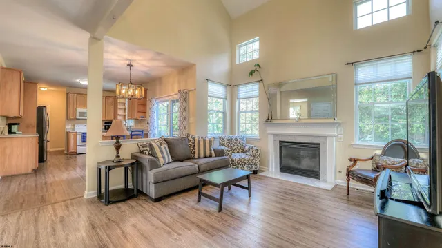 a kitchen with stainless steel appliances wooden cabinets and a refrigerator