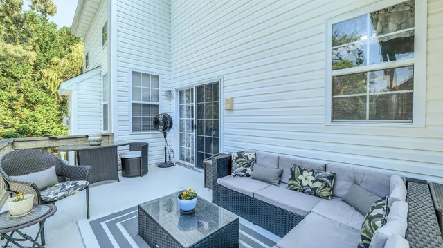 a bedroom with a bed and ceiling chandelier