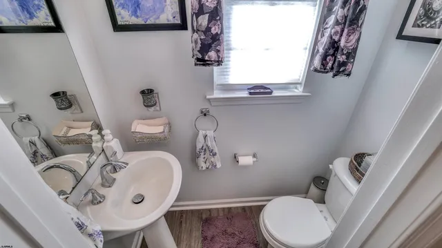 a bathroom with bathtub and window