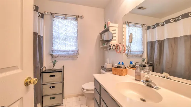 an aerial view of a house with a yard and trees