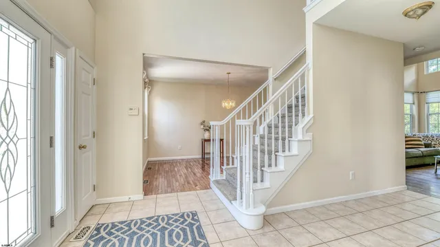 a view of a livingroom with wooden floor and a window