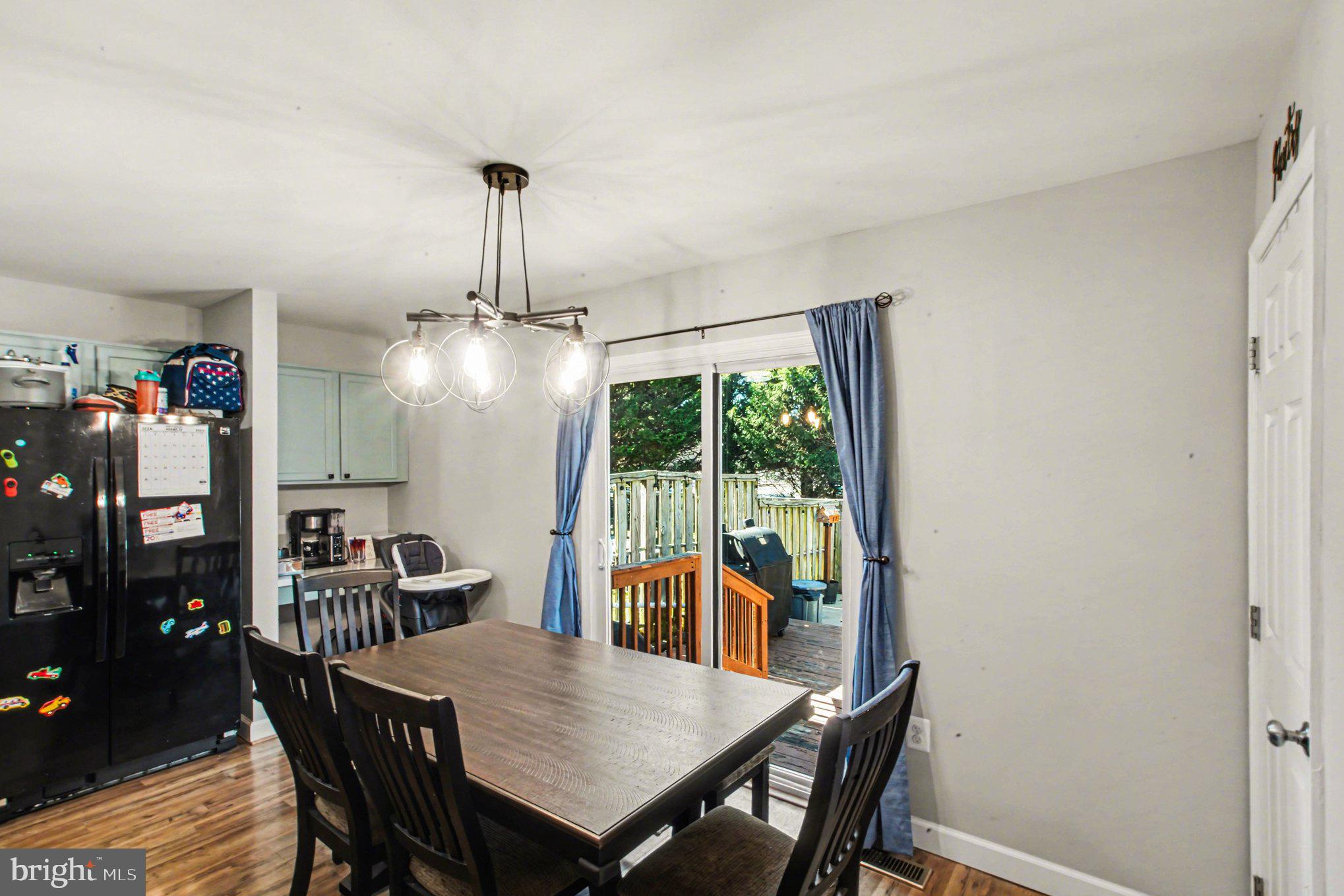 46 Morton Ridge Warrenton, VA 20186 - Photo 11 of 40 a view of a dining room with furniture window and wooden floor