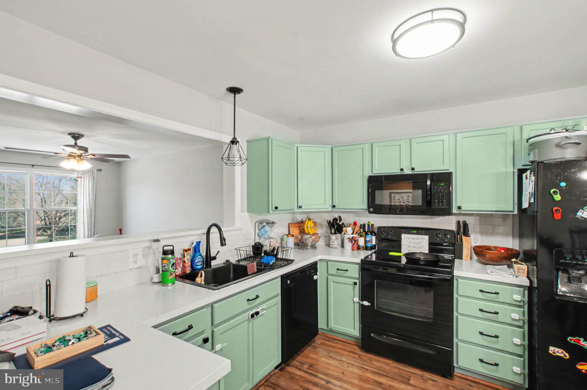 46 Morton Ridge Warrenton, VA 20186 - Photo 12 of 40 a kitchen that has a sink cabinets and a window