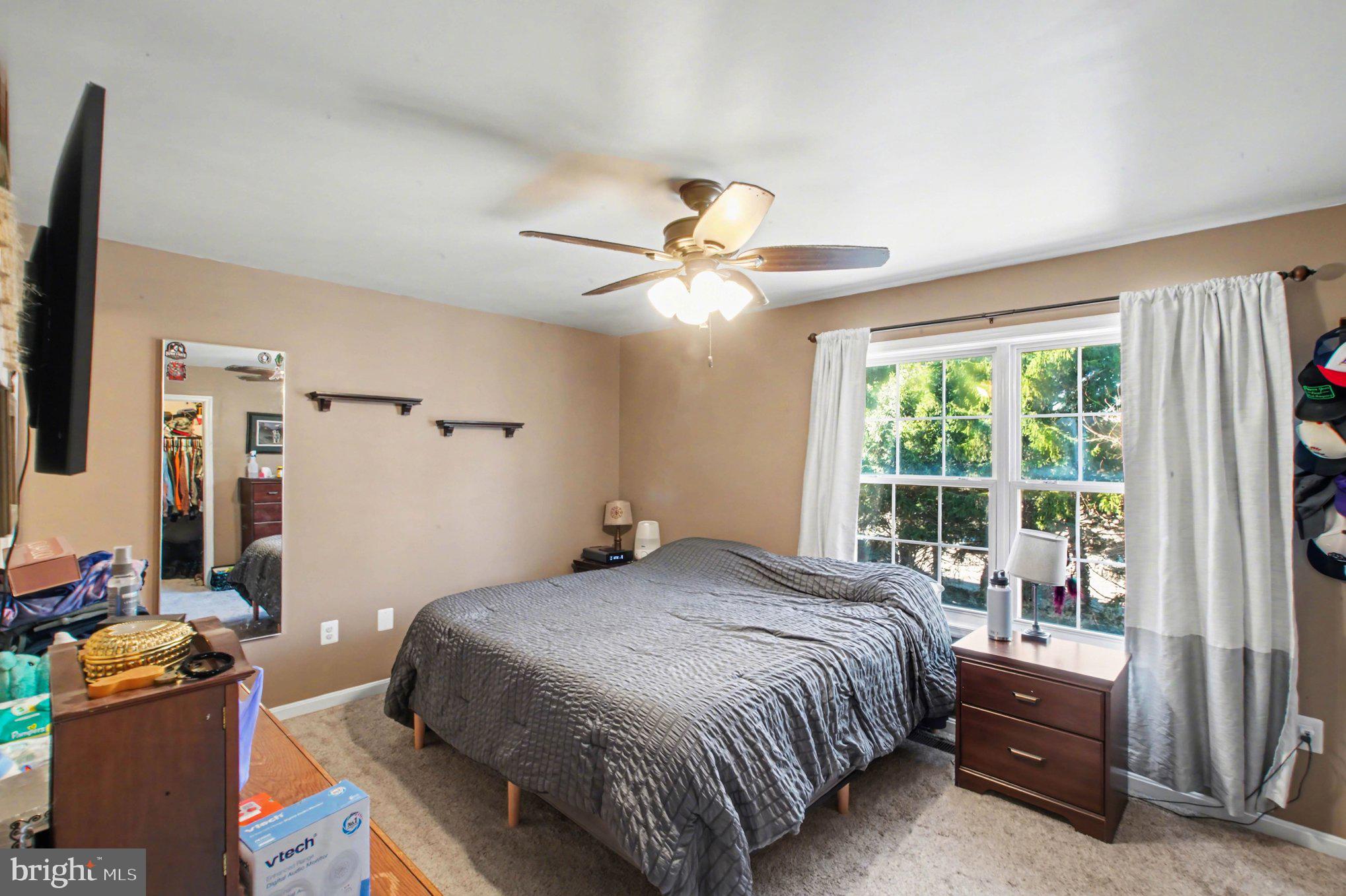 46 Morton Ridge Warrenton, VA 20186 - Photo 18 of 40 a bedroom with a bed and a large window
