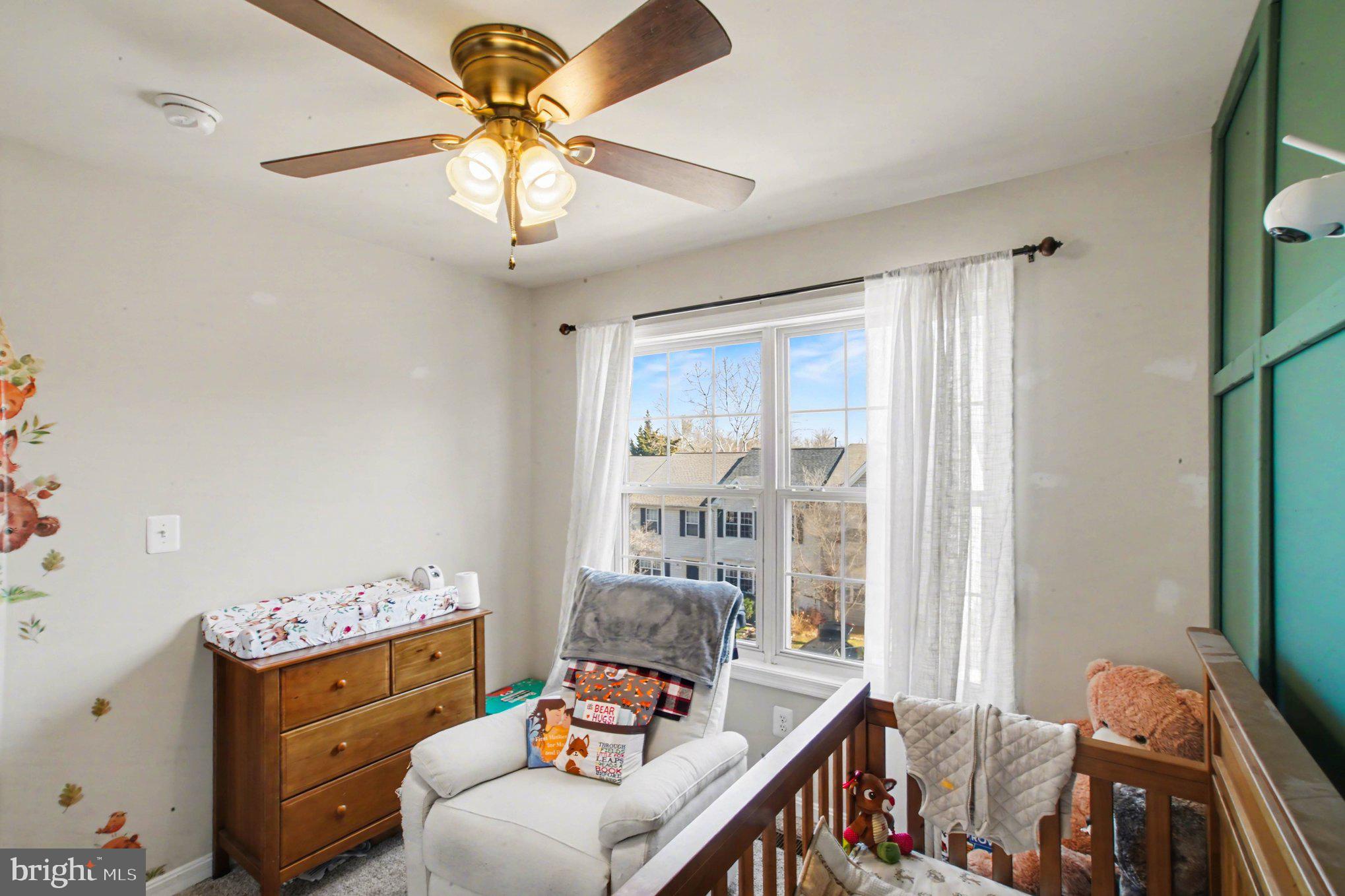 46 Morton Ridge Warrenton, VA 20186 - Photo 27 of 40 a bedroom with furniture and a chandelier